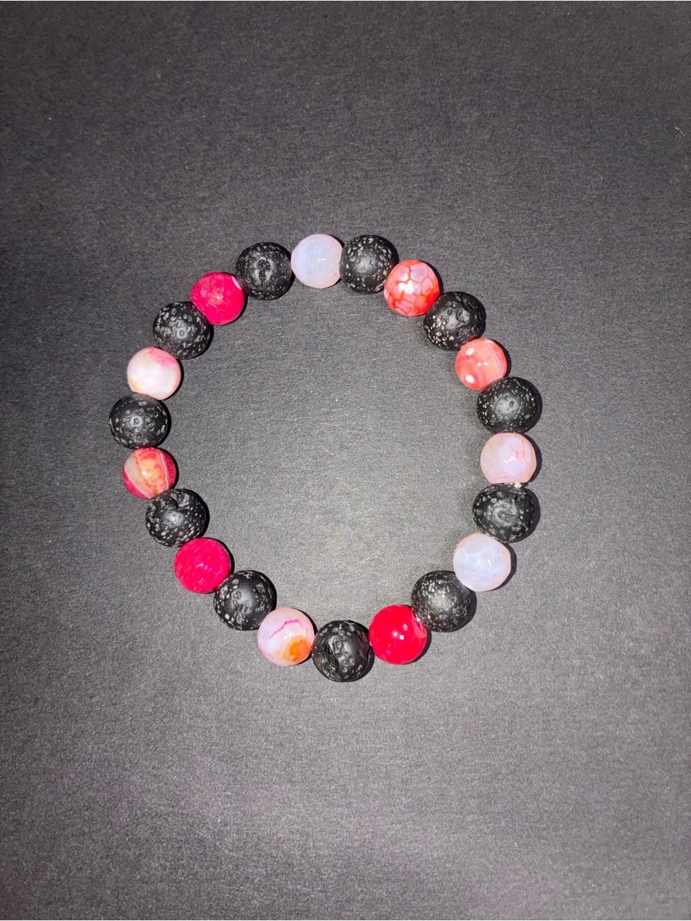 Pink agate and lava bead bracelet